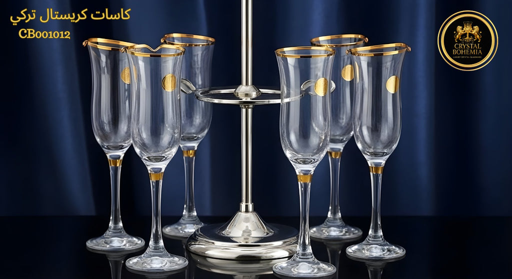 Set of champagne flutes with gold accents on a stand against a dark background
